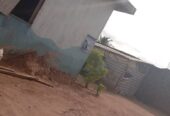 A Standard full plot of land with a demolishable structure and a temporal structure been used for school In a strategic location