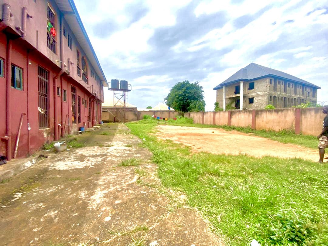 Twenty Four ( 24 ) Rooms Self-Contained Lodge in a plot of land, including an extra Plot of land fenced with gate together with the building available for sell at Igbariam Awka Anambra State