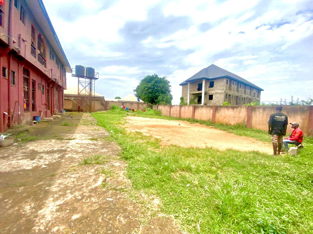 Twenty Four ( 24 ) Rooms Self-Contained Lodge in a plot of land, including an extra Plot of land fenced with gate together with the building available for sell at Igbariam Awka Anambra State