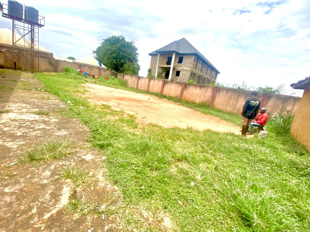 Twenty Four ( 24 ) Rooms Self-Contained Lodge in a plot of land, including an extra Plot of land fenced with gate together with the building available for sell at Igbariam Awka Anambra State