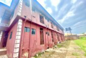 Twenty Four ( 24 ) Rooms Self-Contained Lodge in a plot of land, including an extra Plot of land fenced with gate together with the building available for sell at Igbariam Awka Anambra State