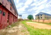 Twenty Four ( 24 ) Rooms Self-Contained Lodge in a plot of land, including an extra Plot of land fenced with gate together with the building available for sell at Igbariam Awka Anambra State