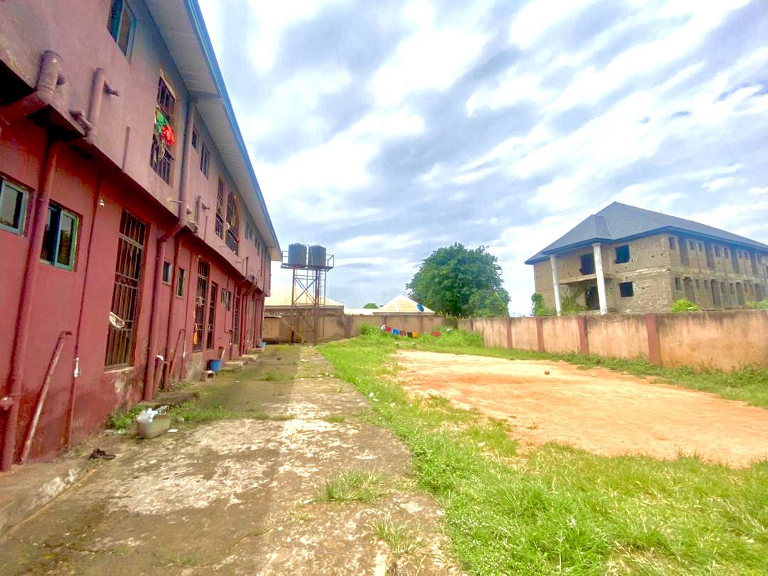 Twenty Four ( 24 ) Rooms Self-Contained Lodge in a plot of land, including an extra Plot of land fenced with gate together with the building available for sell at Igbariam Awka Anambra State