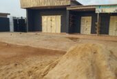 4 bedroom bungalow 5 toilet big car park 2 shop at the front and big warehouse full tiles everywhere water running everywhere . On express road