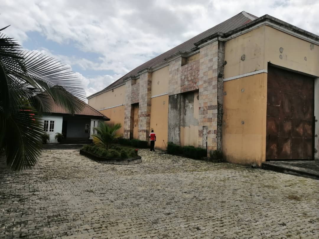 Warehouse for sale. fenced and gated at a strategic location near the major road in town